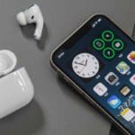iphone and airpods on a table